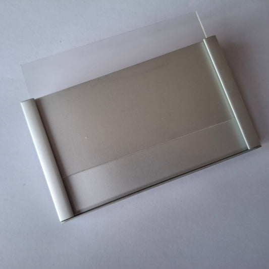 Aluminium Caption Holder (Drop-in) with low reflect acrylic cover 105mm wide x 70mm high.